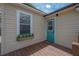 Exterior wooden deck with a window box filled with flowers at 811 W Peninsular St, Tampa, FL 33603