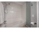 Clean white bathroom featuring a combined shower and tub at 811 W Peninsular St, Tampa, FL 33603