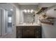 Stylish bathroom featuring a modern vanity with marble countertop and decorative wall shelves at 811 W Peninsular St, Tampa, FL 33603