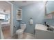 Charming bathroom featuring white fixtures and a peek at an adjacent bedroom at 811 W Peninsular St, Tampa, FL 33603