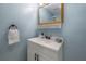 Bathroom featuring updated vanity, faucet, and framed mirror at 811 W Peninsular St, Tampa, FL 33603