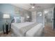 Light and airy bedroom with a ceiling fan and ensuite bathroom at 811 W Peninsular St, Tampa, FL 33603