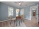 Bedroom with wood floors, desk, fan and two windows for plenty of natural light at 811 W Peninsular St, Tampa, FL 33603