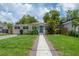 Charming home with well-manicured lawn and inviting curb appeal at 811 W Peninsular St, Tampa, FL 33603