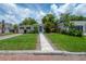 Attractive home with a manicured lawn and a serene, residential street view at 811 W Peninsular St, Tampa, FL 33603