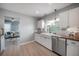 Modern kitchen boasts white cabinets, wood countertops, and a farmhouse sink at 811 W Peninsular St, Tampa, FL 33603