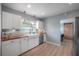 Well-lit kitchen showcasing a farmhouse sink, stainless steel appliances, butcher block counters, and subway tile backsplash at 811 W Peninsular St, Tampa, FL 33603