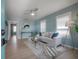 Bright living room with wood floors, plenty of natural light, modern decor, and a ceiling fan at 811 W Peninsular St, Tampa, FL 33603