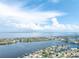 Breathtaking aerial view showcasing a stunning waterfront community, complete with lush landscapes and inviting waterways at 835 Symphony Isles Blvd, Apollo Beach, FL 33572