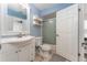A well-lit bathroom with a white vanity, mirror, and shower/tub combo at 835 Symphony Isles Blvd, Apollo Beach, FL 33572