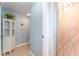 Bathroom with a walk-in shower, tiled floor, and white cabinet at 835 Symphony Isles Blvd, Apollo Beach, FL 33572
