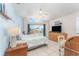 Cozy bedroom with a ceiling fan, comfortable bed, and views of the water at 835 Symphony Isles Blvd, Apollo Beach, FL 33572