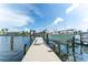 Picture of a well-maintained dock, boat lift, and clear canal waters, perfect for boating enthusiasts at 835 Symphony Isles Blvd, Apollo Beach, FL 33572