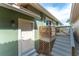 Exterior view of a home's side entrance with stairs and latticework at 835 Symphony Isles Blvd, Apollo Beach, FL 33572