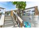 Exterior steps showcasing the waterfront and access to the backyard, perfect for outdoor living at 835 Symphony Isles Blvd, Apollo Beach, FL 33572