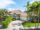 Charming one-story home with vibrant landscaping and a two-car garage at 835 Symphony Isles Blvd, Apollo Beach, FL 33572