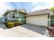 Exterior view of the garage and front lawn at 835 Symphony Isles Blvd, Apollo Beach, FL 33572