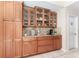 Kitchen with wood cabinets, granite countertops, and modern appliances at 835 Symphony Isles Blvd, Apollo Beach, FL 33572
