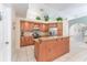Bright kitchen with granite countertops, stainless steel appliances, a breakfast bar, and plenty of storage at 835 Symphony Isles Blvd, Apollo Beach, FL 33572