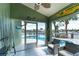 Inviting lanai with outdoor seating, overlooking a sparkling pool and waterfront view at 835 Symphony Isles Blvd, Apollo Beach, FL 33572