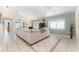 Spacious living room featuring high ceilings, tile floors and ample natural light at 835 Symphony Isles Blvd, Apollo Beach, FL 33572