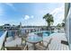 Beautiful waterfront patio with seating area, canal views and lush tropical landscaping at 835 Symphony Isles Blvd, Apollo Beach, FL 33572