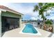 A gorgeous outdoor space featuring a private pool, spacious deck, and stunning waterfront views at 835 Symphony Isles Blvd, Apollo Beach, FL 33572