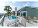 Beautiful outdoor pool and deck area with canal views, patio seating and lush tropical landscaping at 835 Symphony Isles Blvd, Apollo Beach, FL 33572