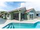 Inviting backyard with a pristine pool, screened lanai, and spacious deck perfect for outdoor entertaining at 835 Symphony Isles Blvd, Apollo Beach, FL 33572