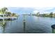 Peaceful water view surrounded by lush greenery with boats docked nearby offering a serene and picturesque setting at 835 Symphony Isles Blvd, Apollo Beach, FL 33572