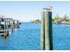 A scenic view of the calm waterfront from a private dock post, offering a serene and inviting atmosphere at 835 Symphony Isles Blvd, Apollo Beach, FL 33572