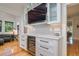 Stylish bar area featuring custom cabinetry, a wine refrigerator, and elegant countertops for entertaining at 842 S Boulevard, Tampa, FL 33606
