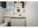 Compact bathroom with classic black and white tiles, a vanity, and efficient layout at 842 S Boulevard, Tampa, FL 33606