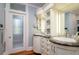 Elegant bathroom featuring dual sinks with a beautiful marble countertop and custom cabinetry at 842 S Boulevard, Tampa, FL 33606