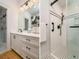 Elegant bathroom with a glass-door shower, sleek vanity, and eye-catching checkered floor at 842 S Boulevard, Tampa, FL 33606
