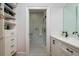 En suite bathroom with checkered tile floors, walk-in shower, and built-in storage at 842 S Boulevard, Tampa, FL 33606