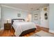 Comfortable bedroom with a queen bed, wood floors, and soft natural lighting at 842 S Boulevard, Tampa, FL 33606