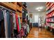 Walk-in closet with custom shelving, ample storage, wooden floors, and room to organize apparel at 842 S Boulevard, Tampa, FL 33606