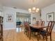 Dining room with hardwood floors, chandelier, and open to living room at 842 S Boulevard, Tampa, FL 33606
