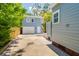 Backyard view of a detached garage and fenced yard, offering ample space and privacy at 842 S Boulevard, Tampa, FL 33606