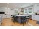 Spacious kitchen with a large island, modern appliances, and wood floors, perfect for cooking and entertaining guests at 842 S Boulevard, Tampa, FL 33606