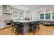 Open-concept kitchen showcases a large center island with seating, stainless steel appliances, and seamless flow to the living area at 842 S Boulevard, Tampa, FL 33606