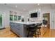 Spacious kitchen island with seating, custom cabinetry, and an open layout leading to adjacent living spaces at 842 S Boulevard, Tampa, FL 33606