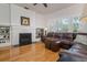 Cozy living room with a brick fireplace, built-in bookshelves, and comfortable seating perfect for relaxing at 842 S Boulevard, Tampa, FL 33606