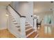Elegant staircase with white railing and a dining room visible in the background at 842 S Boulevard, Tampa, FL 33606