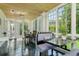 Sun room with black tile floors, bead-board ceiling and multiple windows at 842 S Boulevard, Tampa, FL 33606