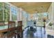 Bright sun room with slate tile flooring and walls of windows at 842 S Boulevard, Tampa, FL 33606