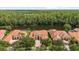 Beautiful neighborhood featuring homes with terracotta roofs, mature trees, and waterfront views at 8476 Dunham Station Dr, Tampa, FL 33647