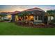 Lovely home backyard featuring a swimming pool, patio, and well-manicured lawn, ideal for relaxation and entertainment at 8476 Dunham Station Dr, Tampa, FL 33647