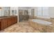 Bathroom with soaking tub and glass shower at 8476 Dunham Station Dr, Tampa, FL 33647